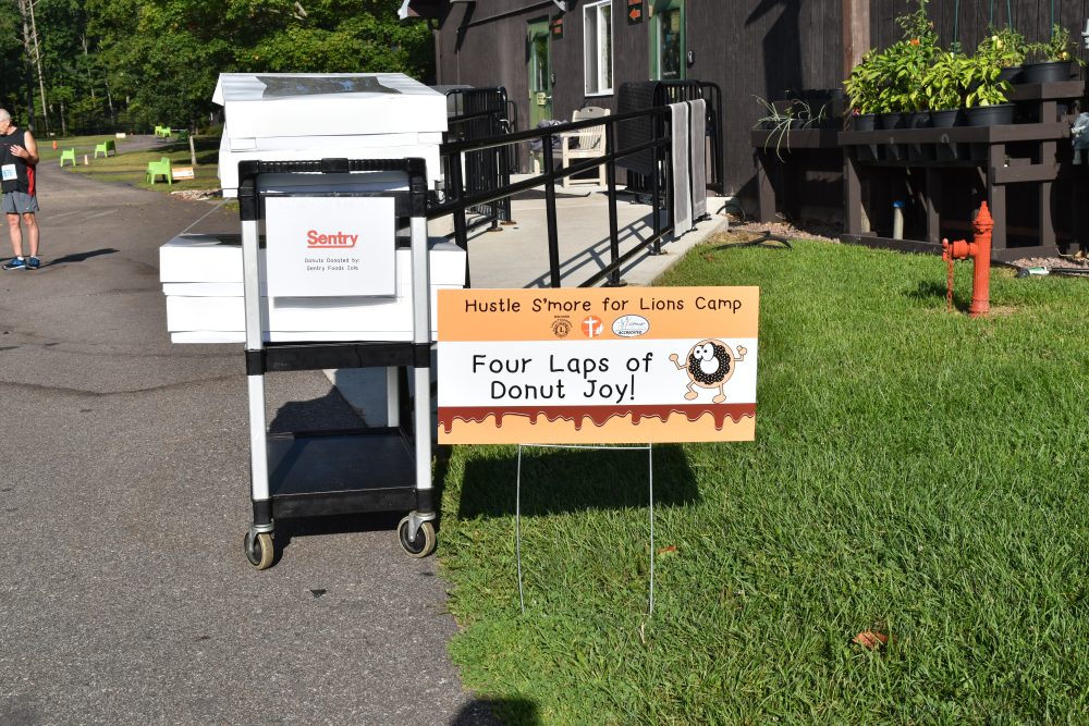 Donut Dash Sign that says Four Laps of Donut Joy!