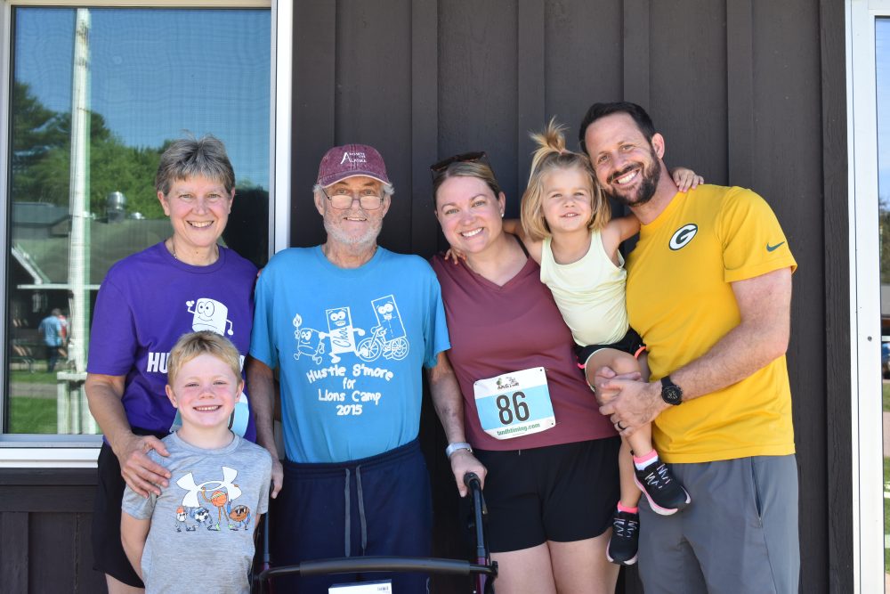 Family picture at the Hustle S'more for Lions Camp event